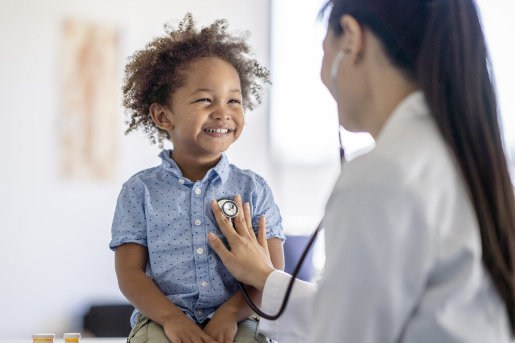 Doctor Listening to Little Boys Heart at an urgent care